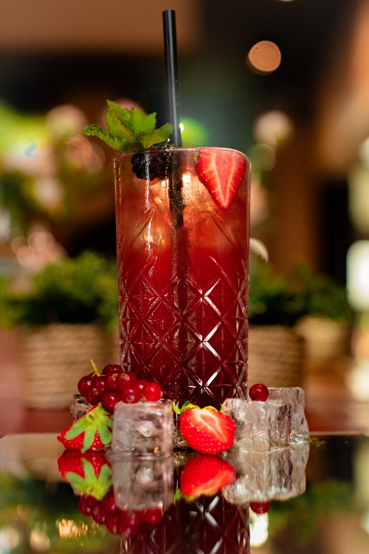 Artisan red berry cocktail with fresh mint and berries