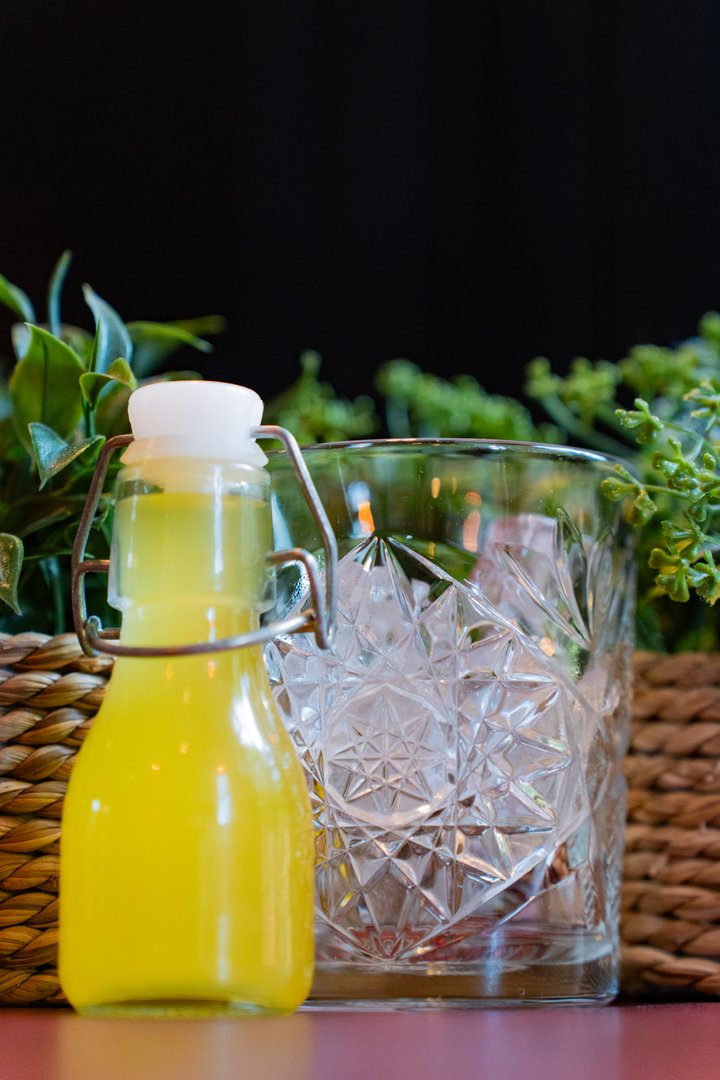 Refreshing yellow beverage with natural presentation